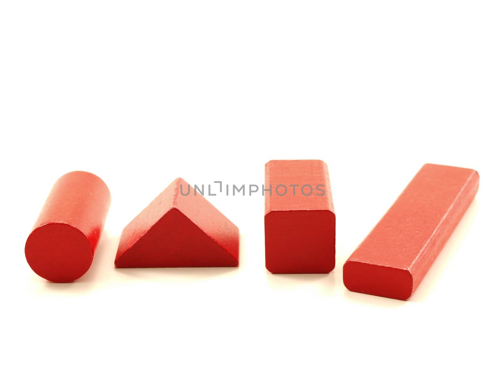 Wooden brick pieces of red color, isolated towards white