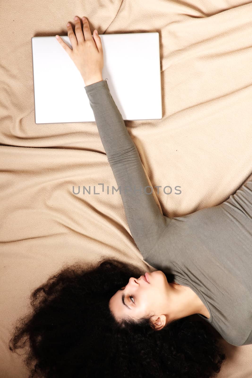 A young adult woman with a Laptop.