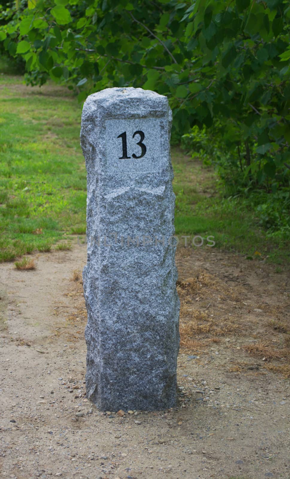 Mile marker thirteen along the Blackstone River Bikeway in Cumberland, Rhode Island.