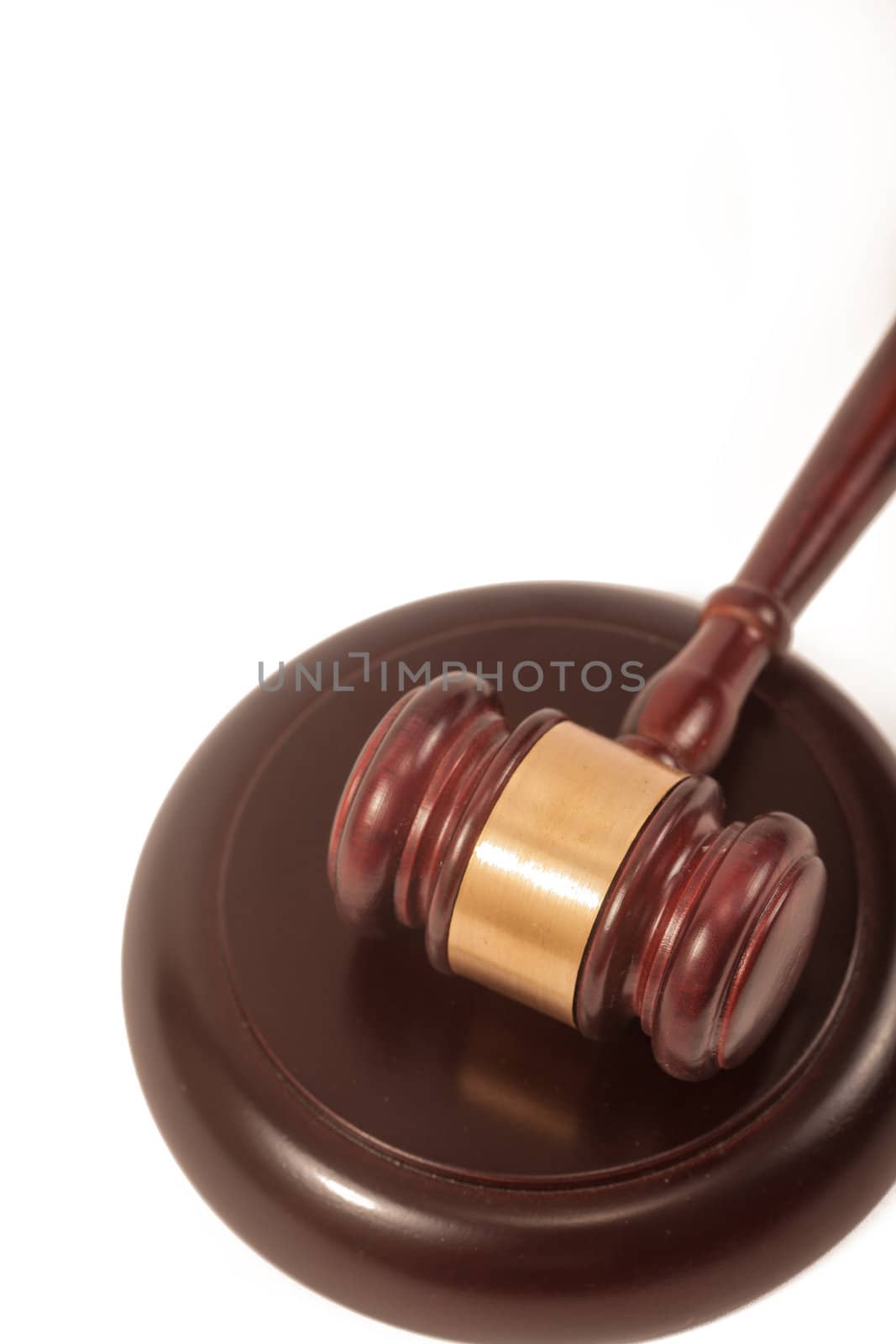 A wooden gavel and soundboard, isolated on a white background.