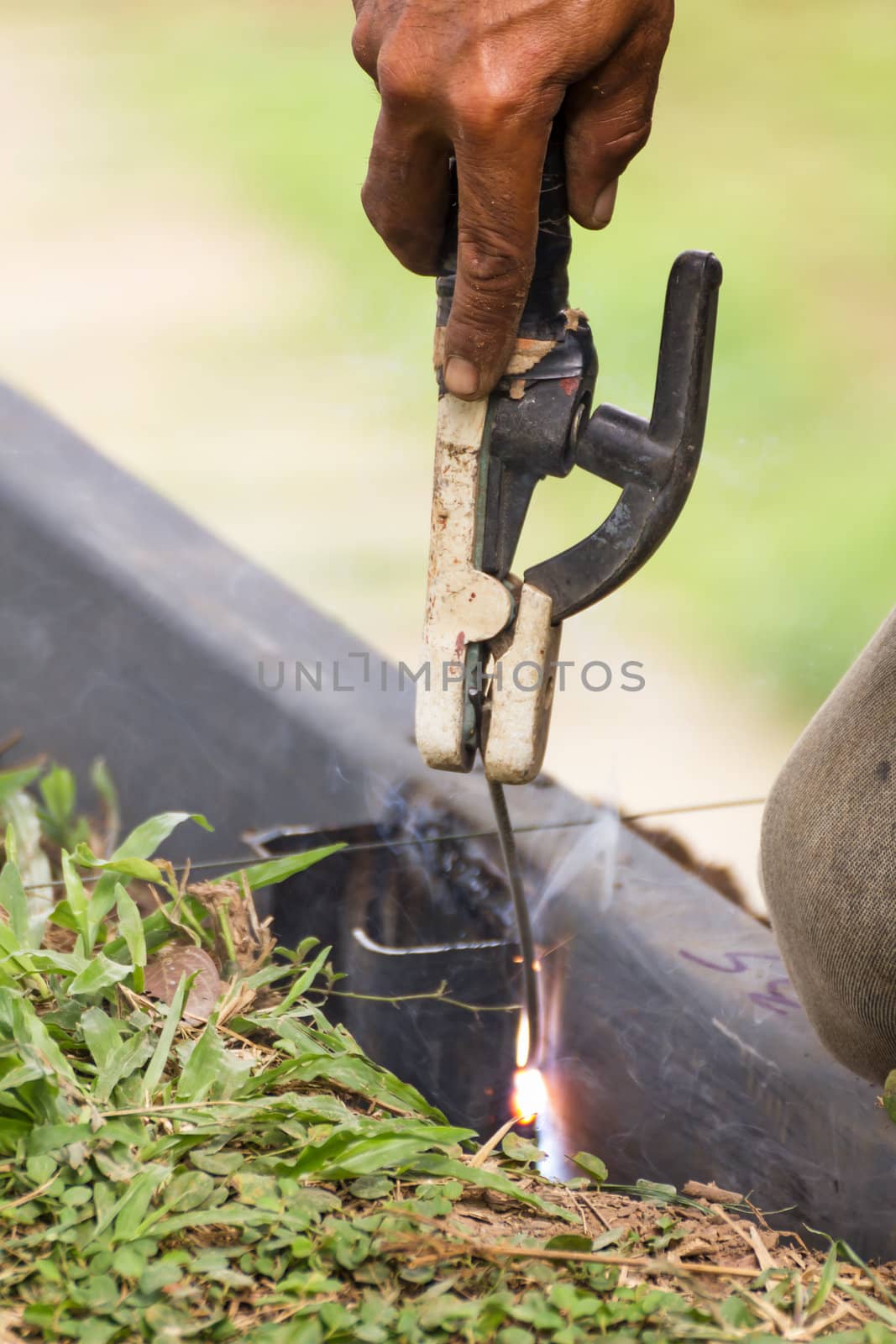 Welder welding  elements at the  construction site