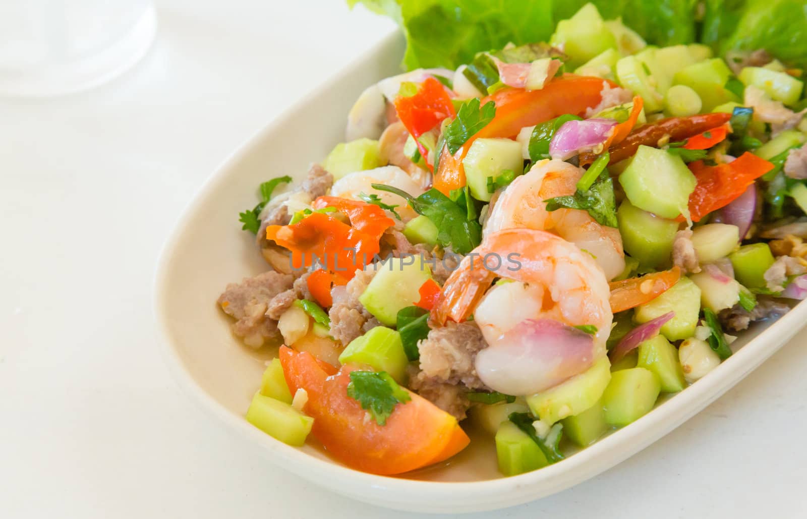 thai food kale with prawn salad on white table