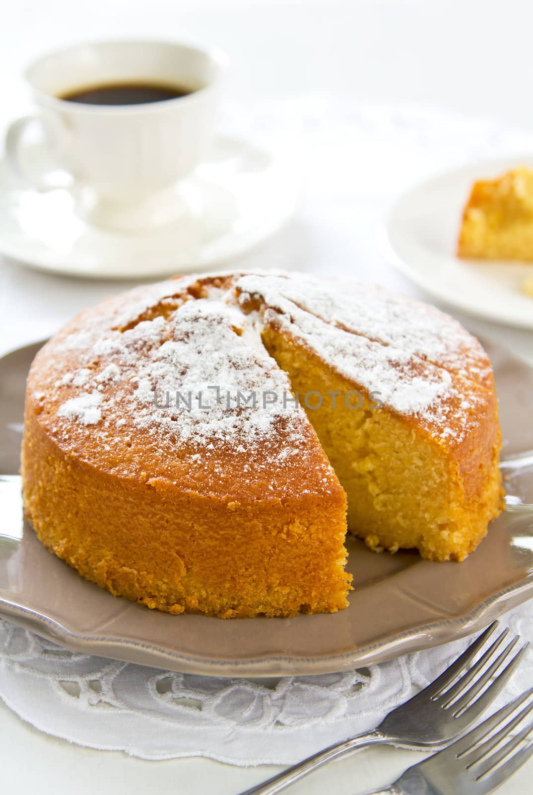 Butter cake with orange zest and juice by coffee