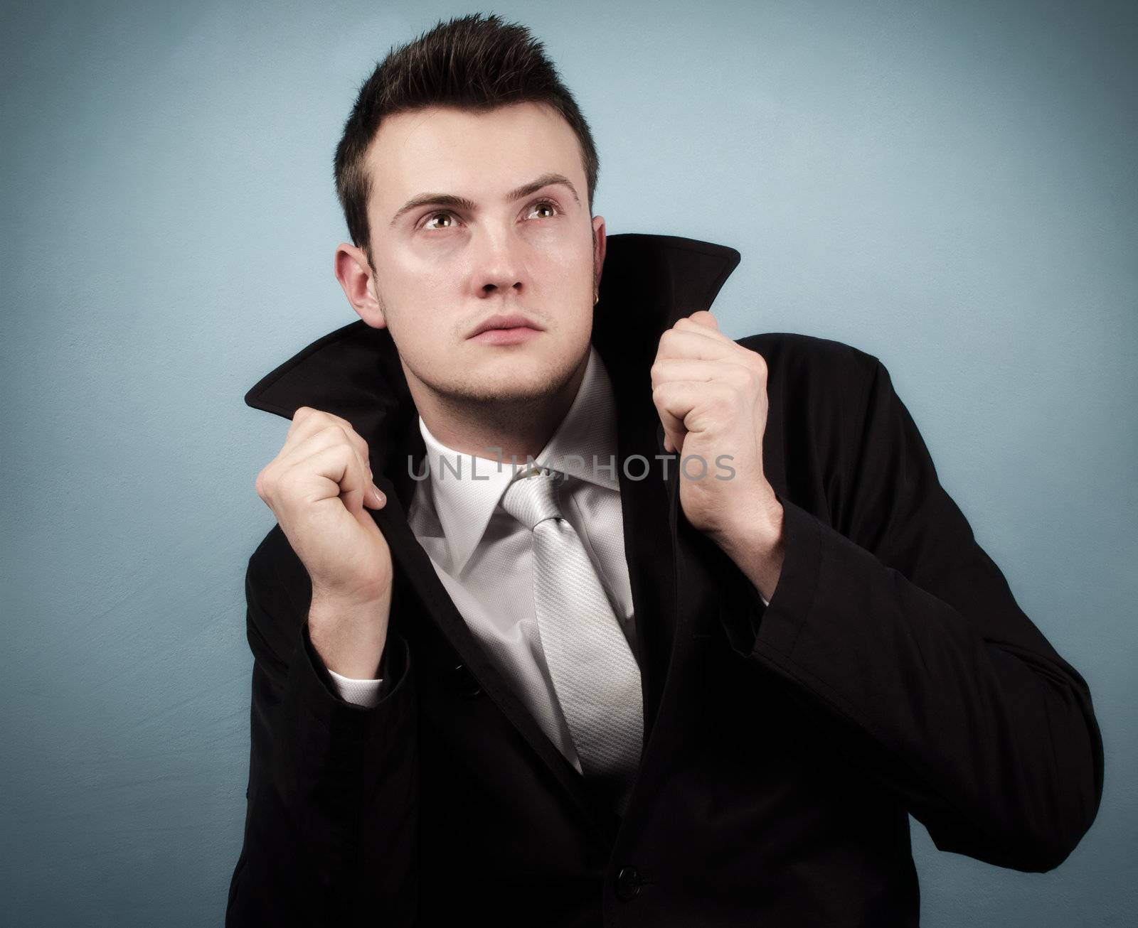 Young successful businessman in elegant suit