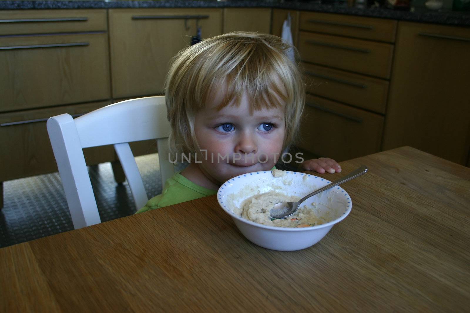 Toddler eating breakfast by annems