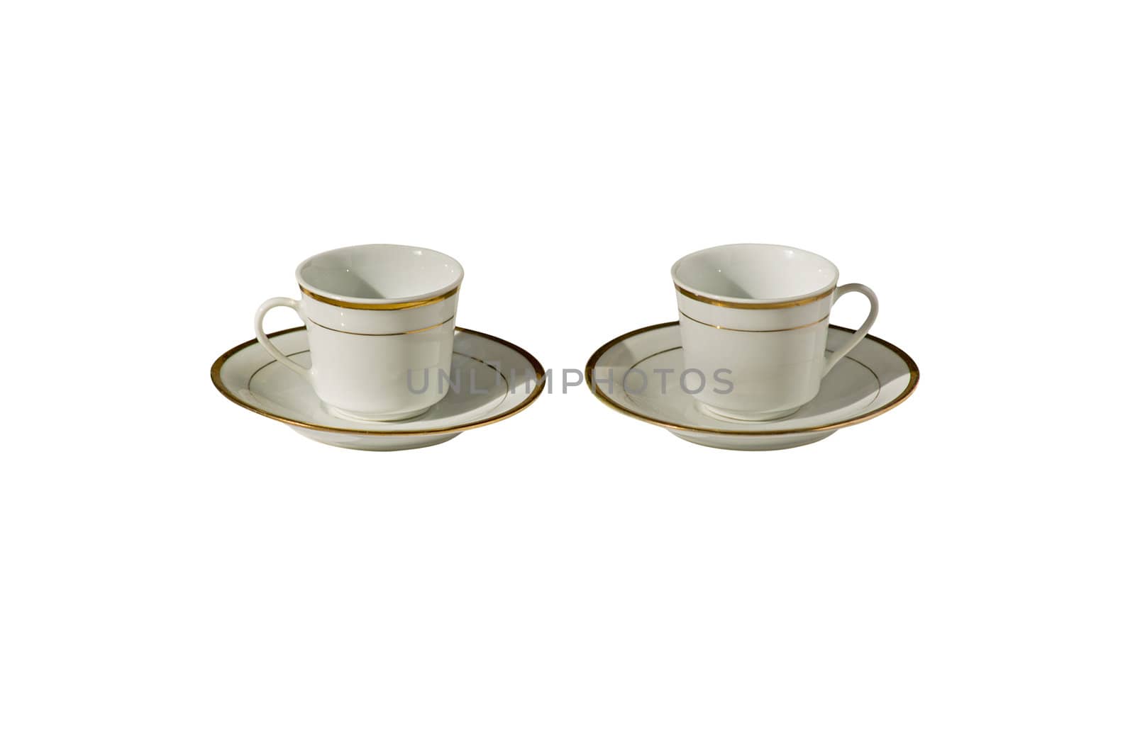 Two white gold-plated cups isolated on white