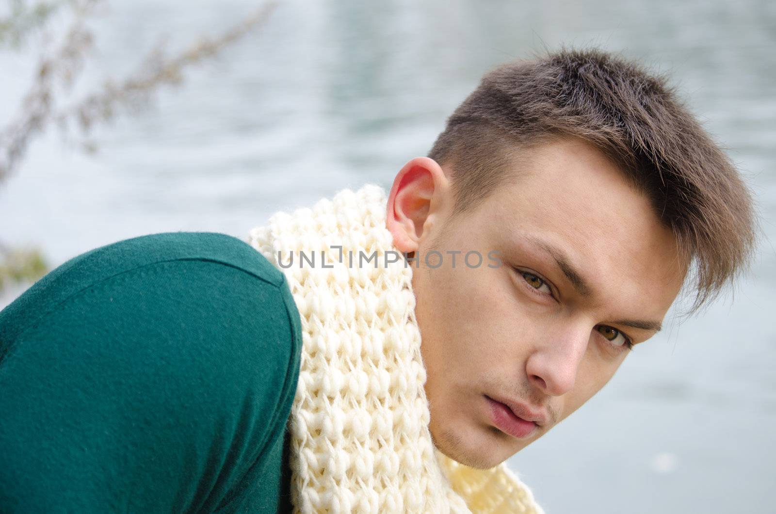 Good looking young man outdoors in nature (river, lake) by artofphoto