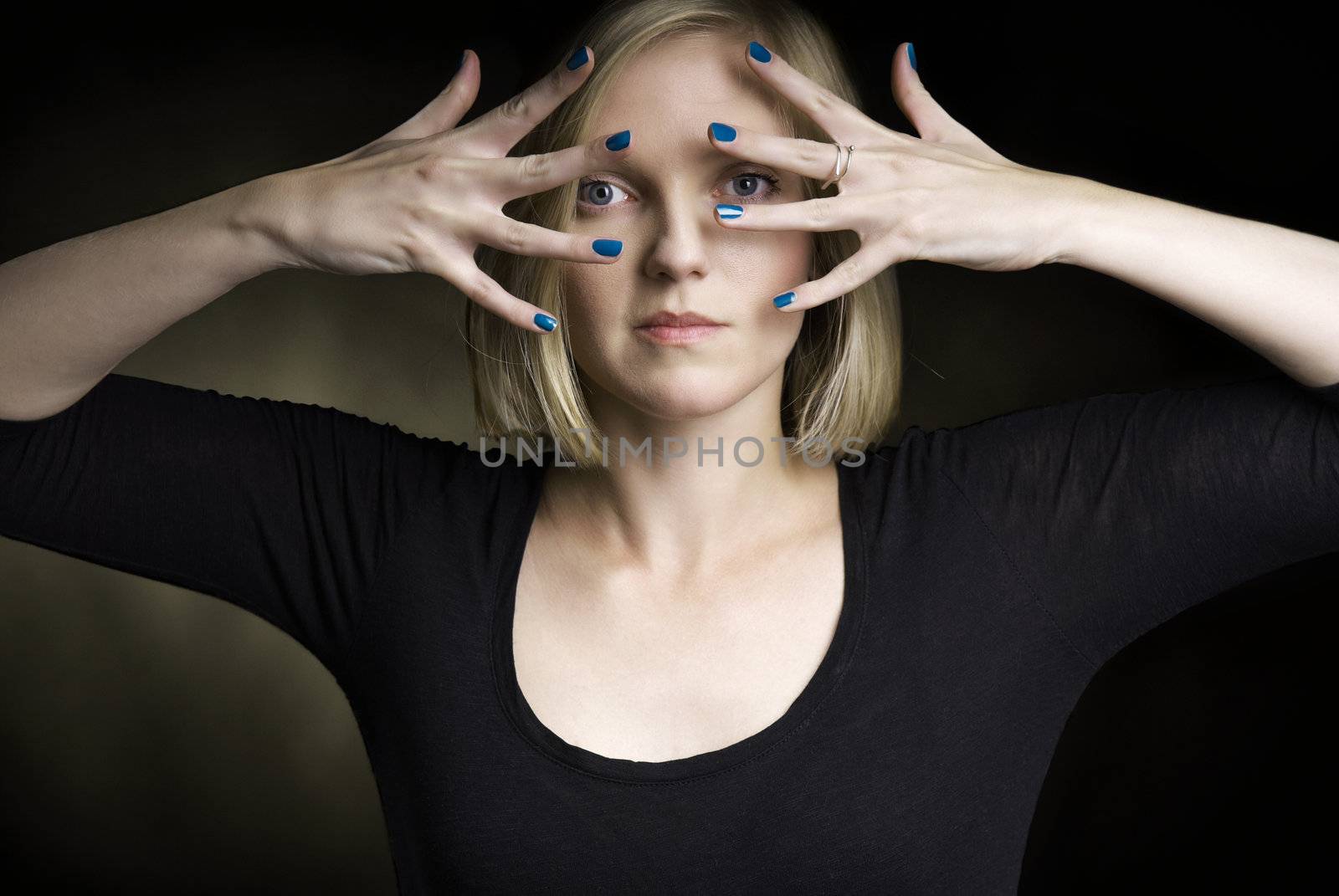 Stuido shot of young attractive woman on black background