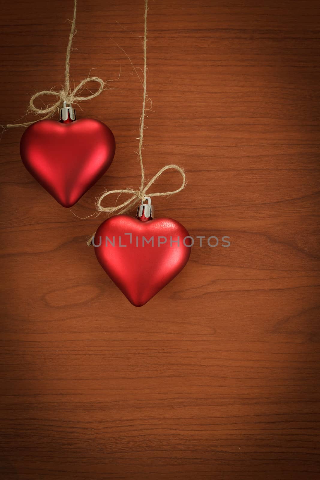 wooden board for valentine message with two red hearts