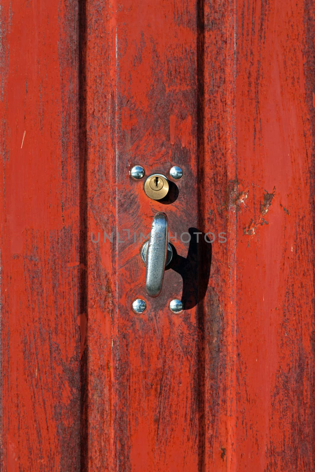 old red locker closed with old padlock