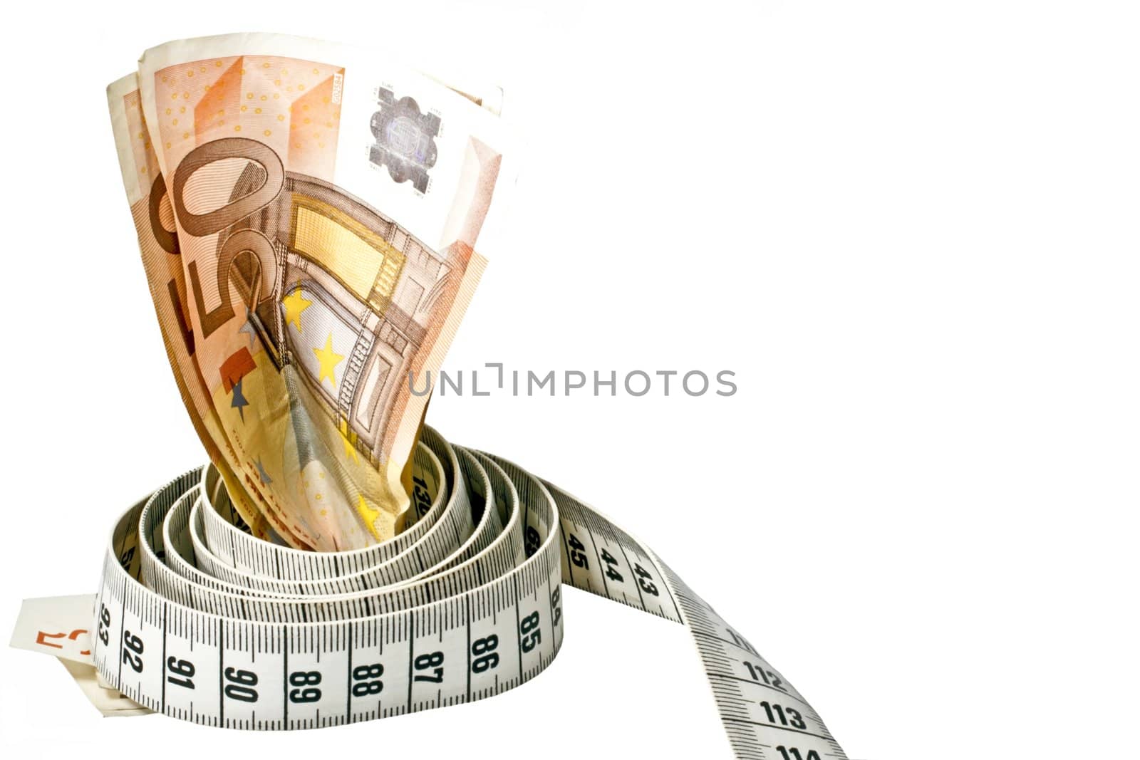 Money with a tape measure wrapped around it over a white background