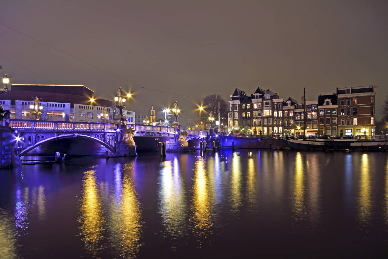 Amsterdam by night with the Blue Bridge at the Amstel in the Net by devy