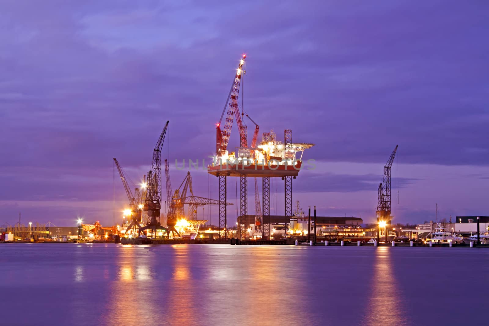 Derrick at night in the harbor from Amsterdam the Netherlands by devy