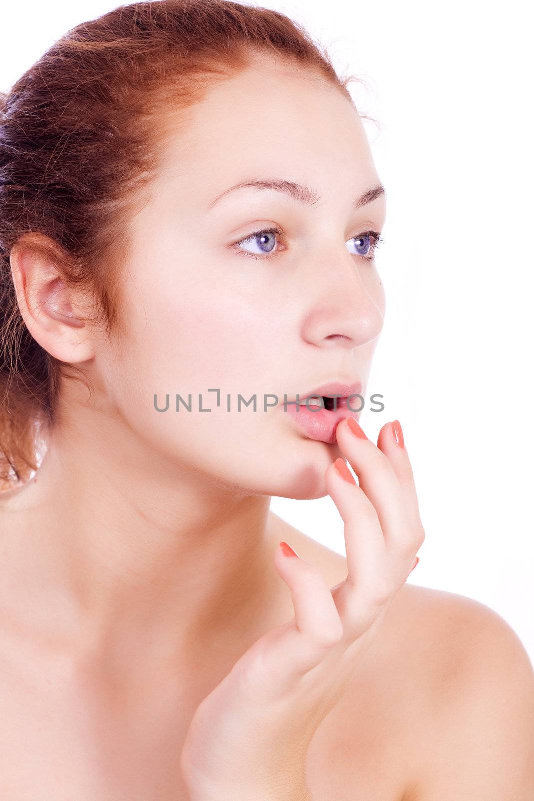 Wellness, healthcare, skin care. Lovely woman touching her lips on white backgroun.
