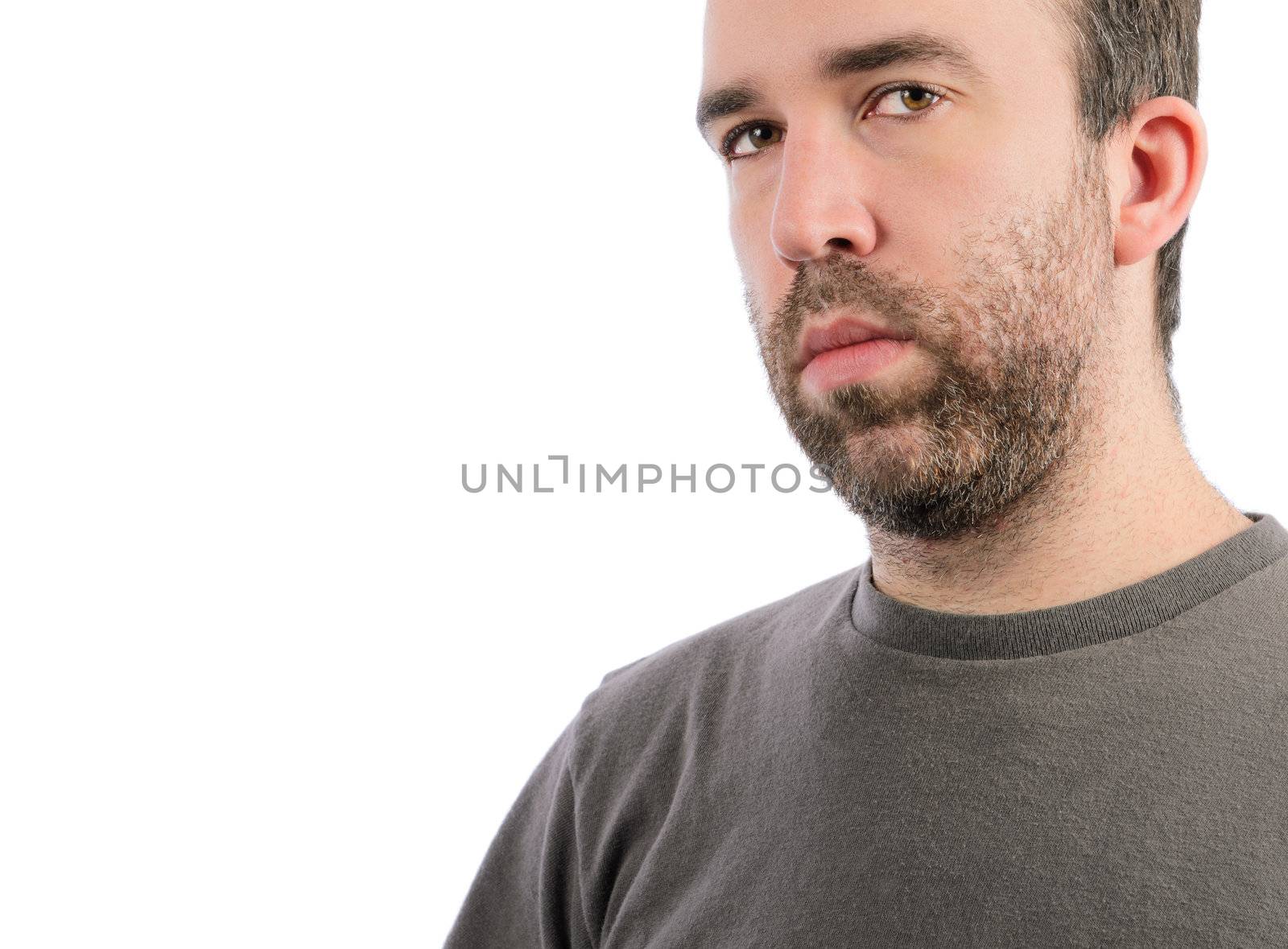 A serious man with a beard, isolated on a white background.
