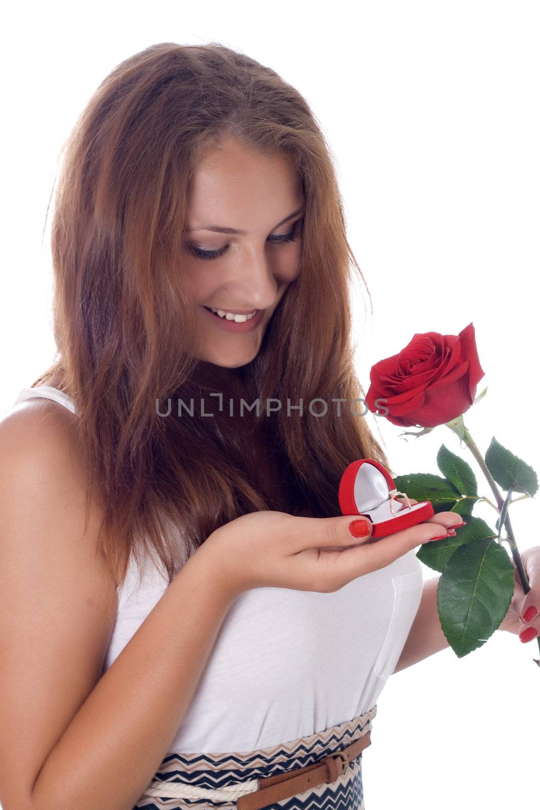 girl was presented with a red rose and a box with a ring