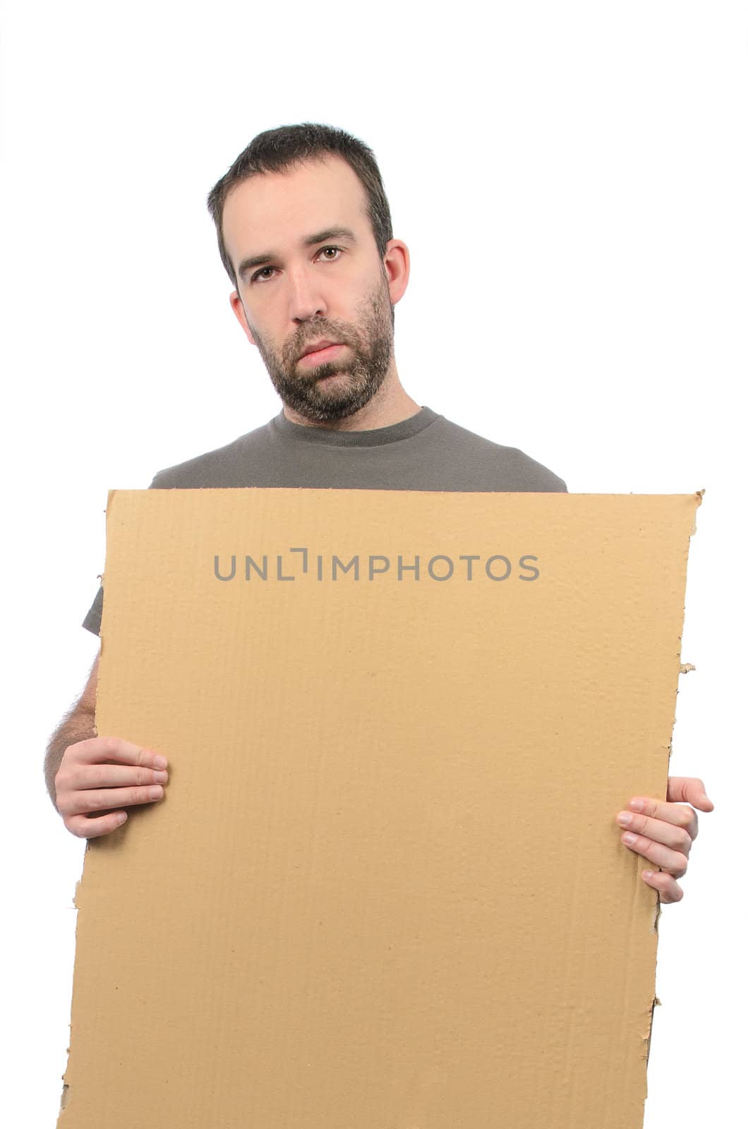 A scruffy looking guy holding a cardboard sign, isolated on a white background.