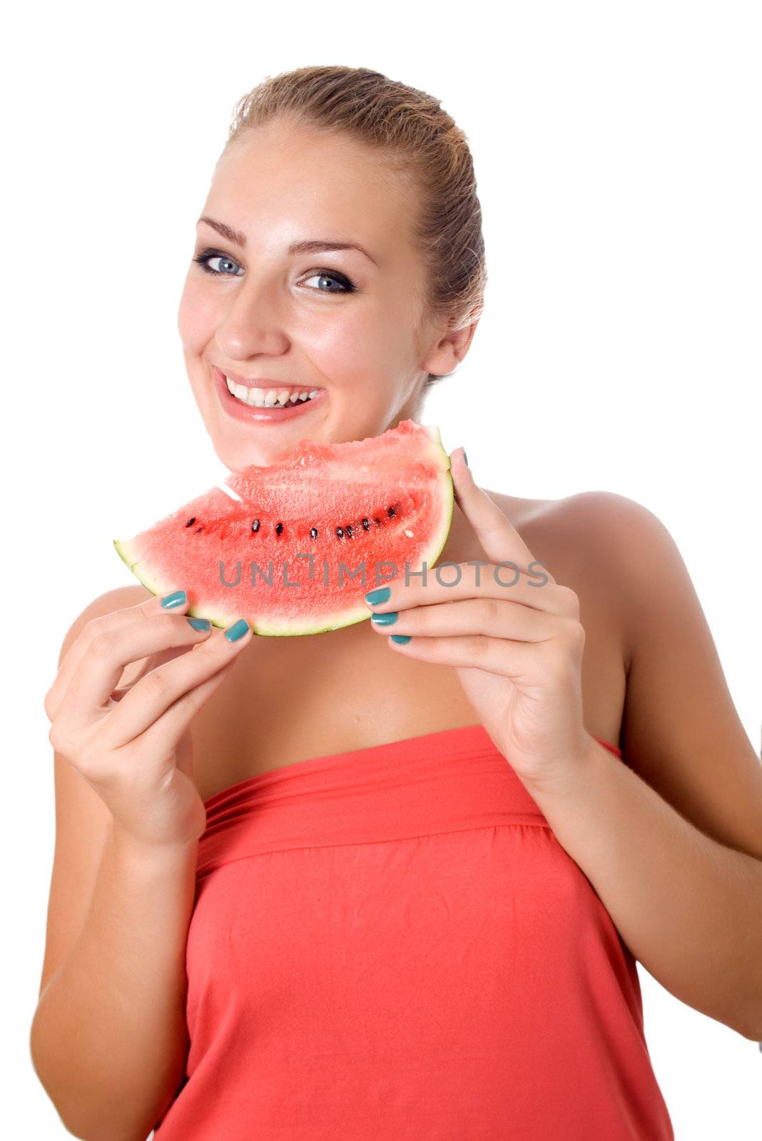 Woman against white background taking a bite of watermelon.