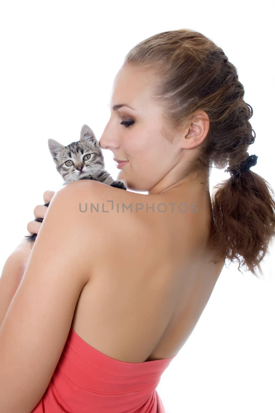 Portrait of a cute girl with a kitten against white background
