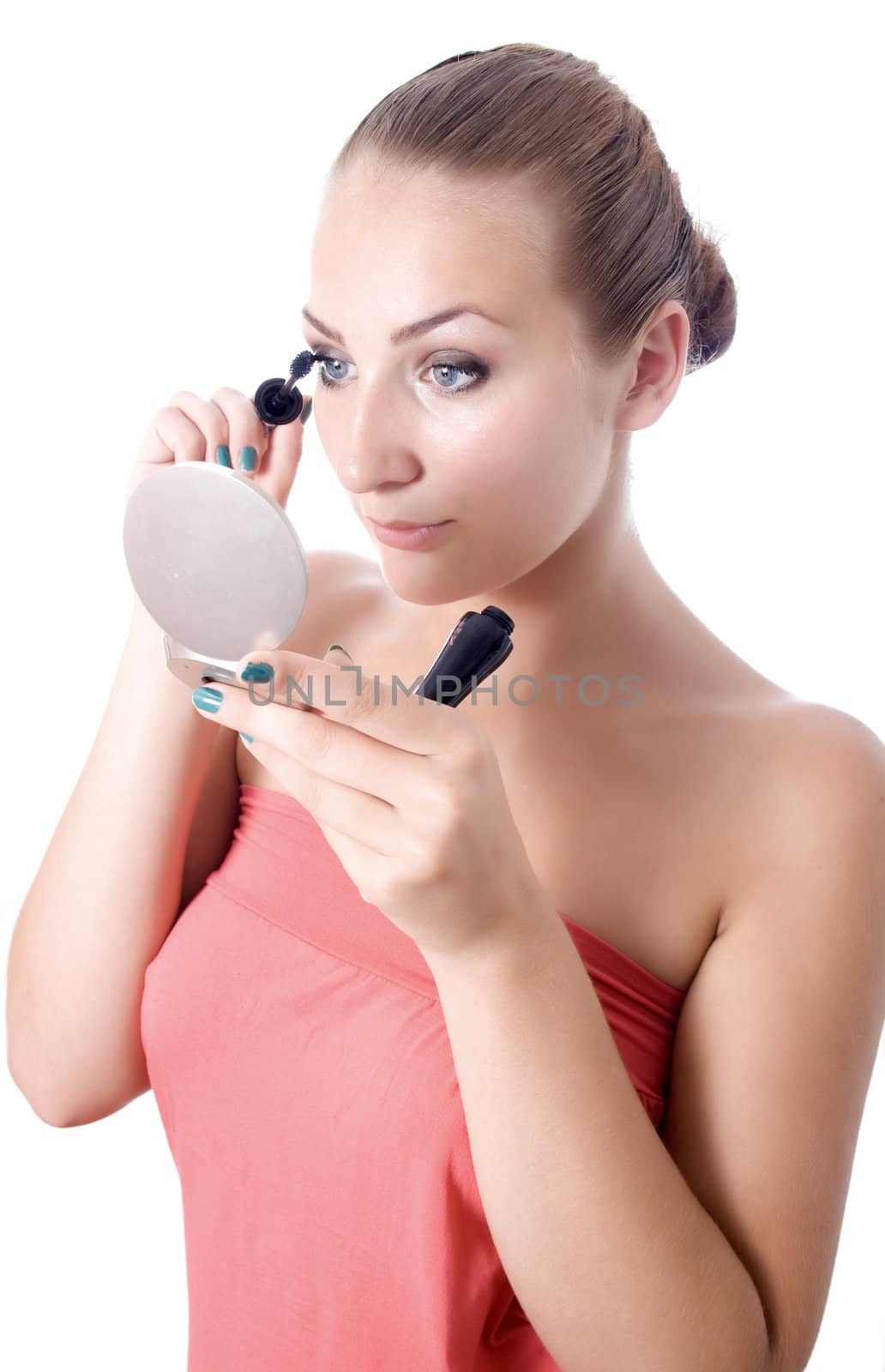 portrait beautiful young woman bare shoulders looks mirror paints eyelashes background 