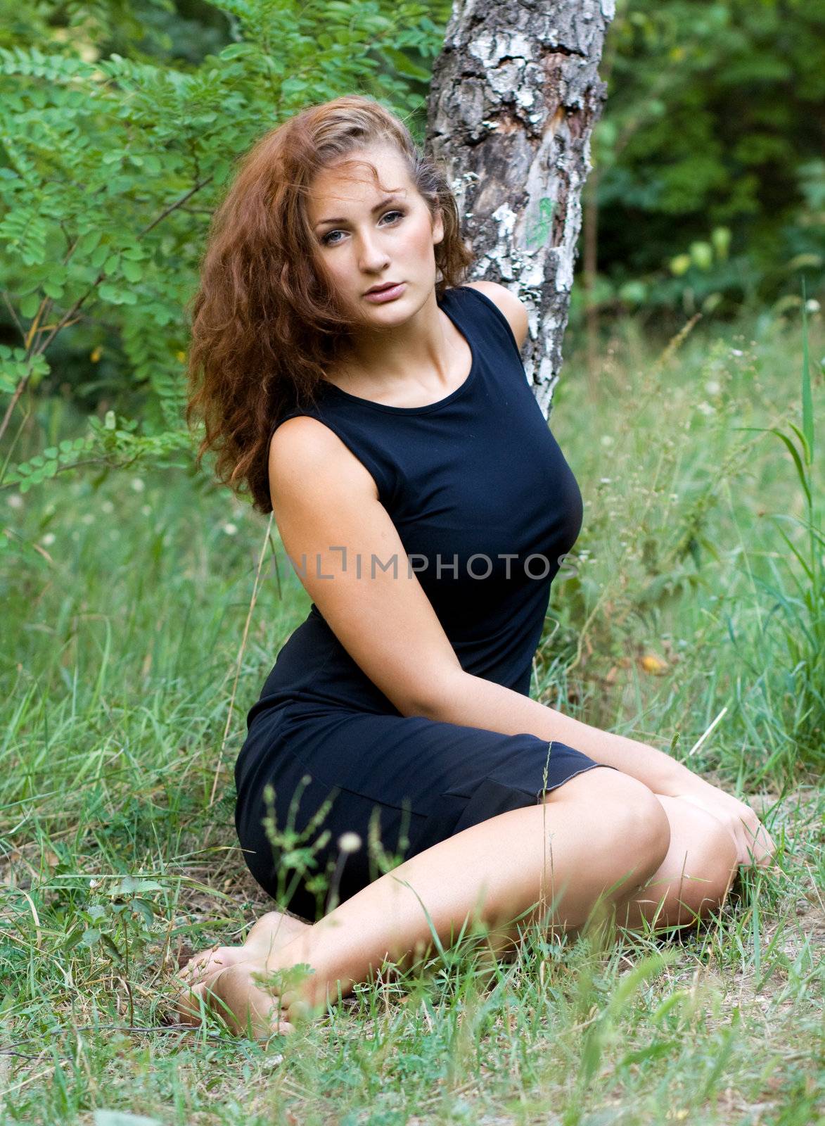 beautiful girl on a background of green nature by Irina1977