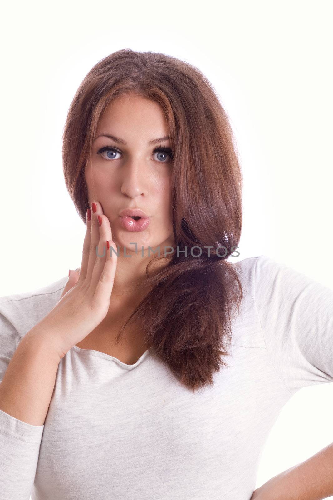 portrait of a surprised young woman, isolated against white background