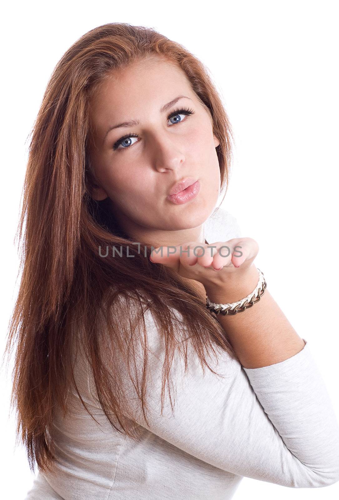 cute young female blowing a kiss ,white background