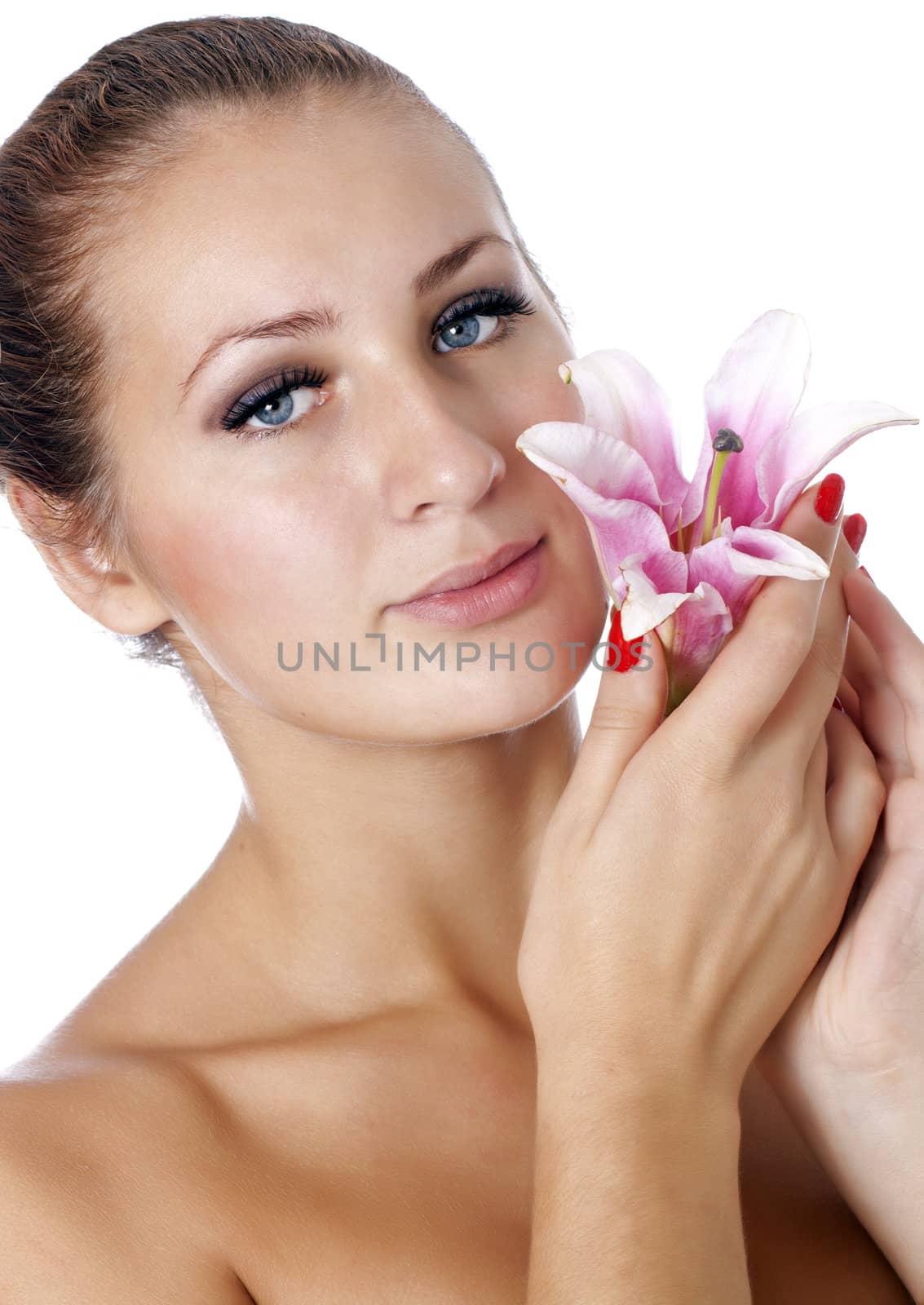 Pretty face of beautiful young woman with lily on hands - white background