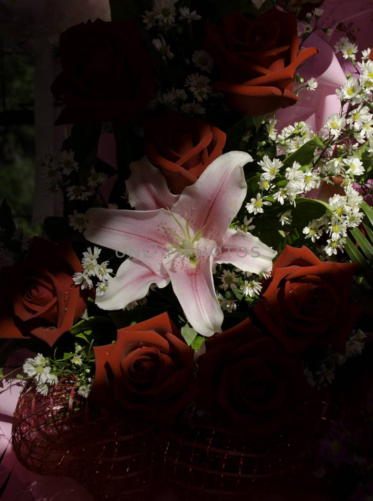 Bouquet of pink lily with red roses