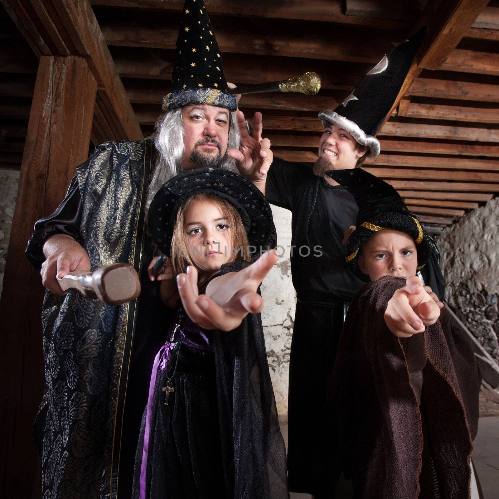 Cute family of people dressed in Halloween costumes