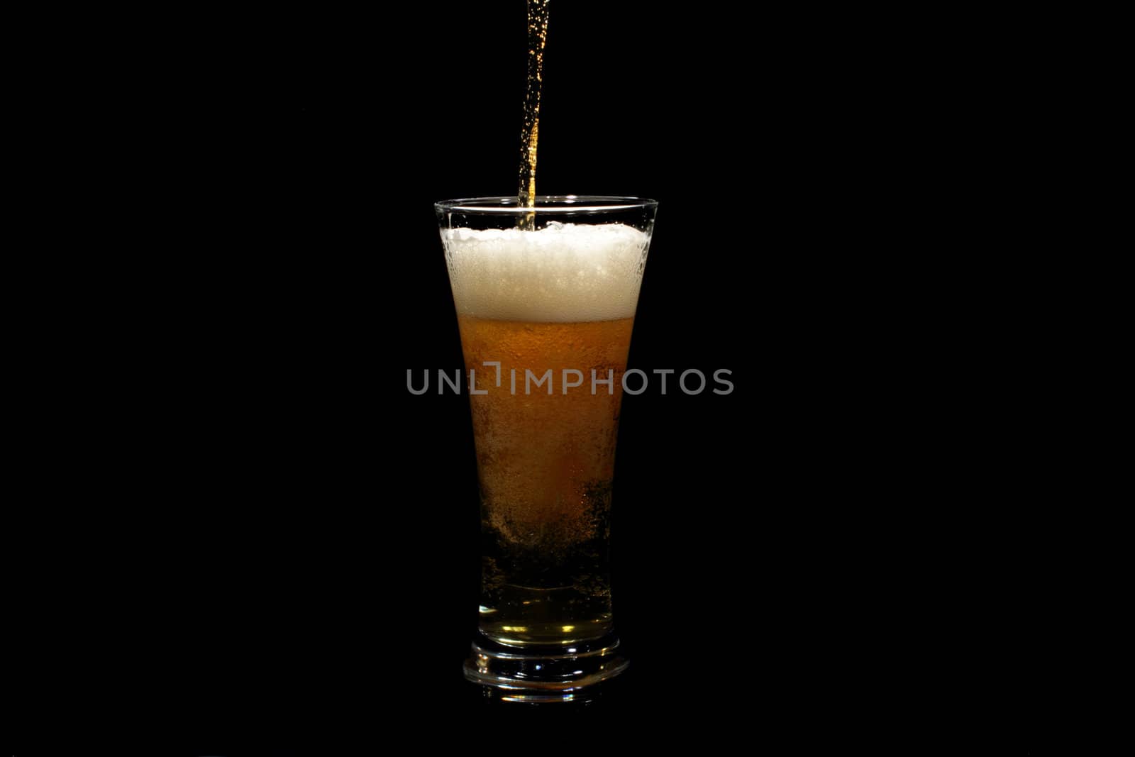 Beer pouring into a glass by devy