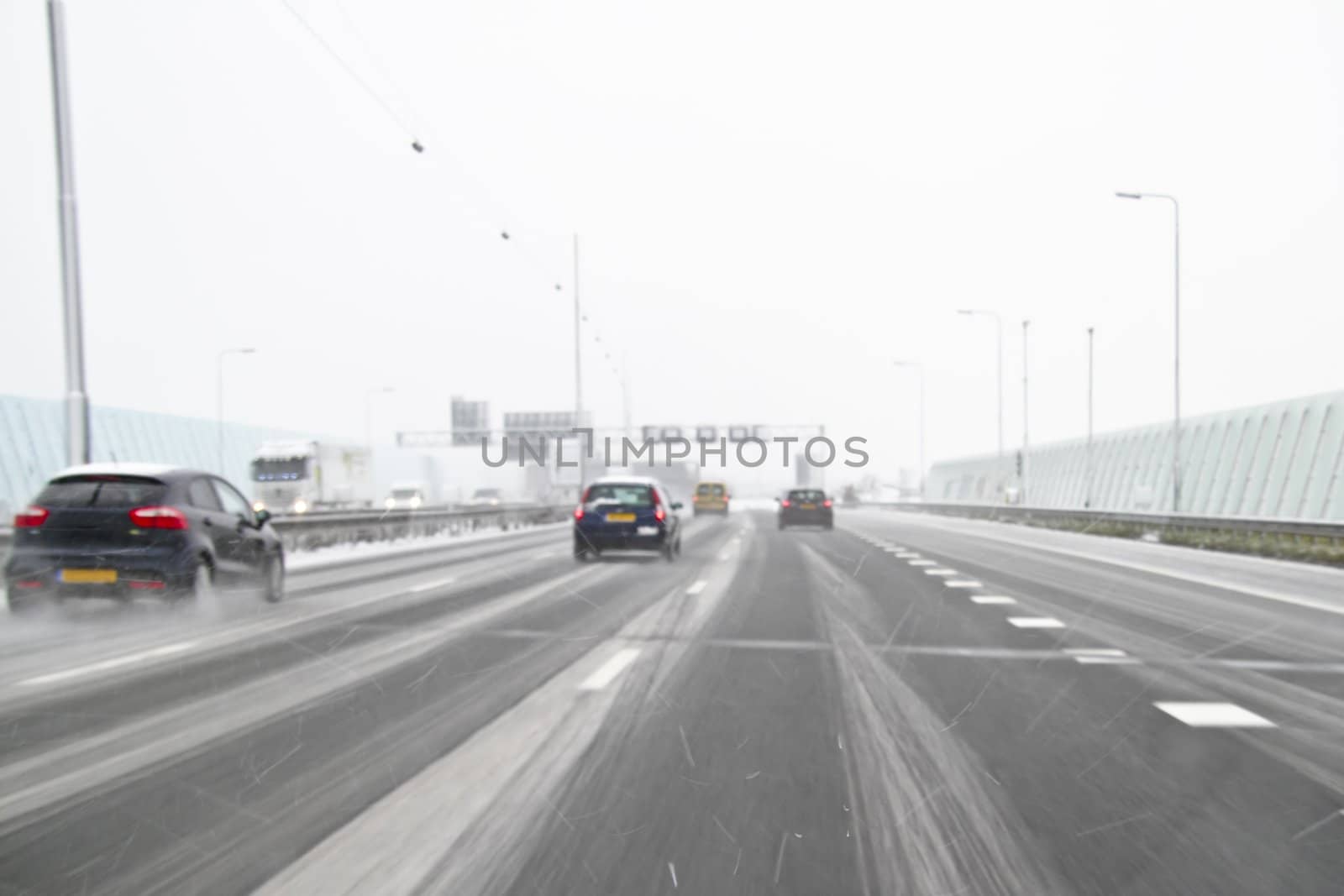 Driving in A snowstorm on the highway A10 in the Netherlands