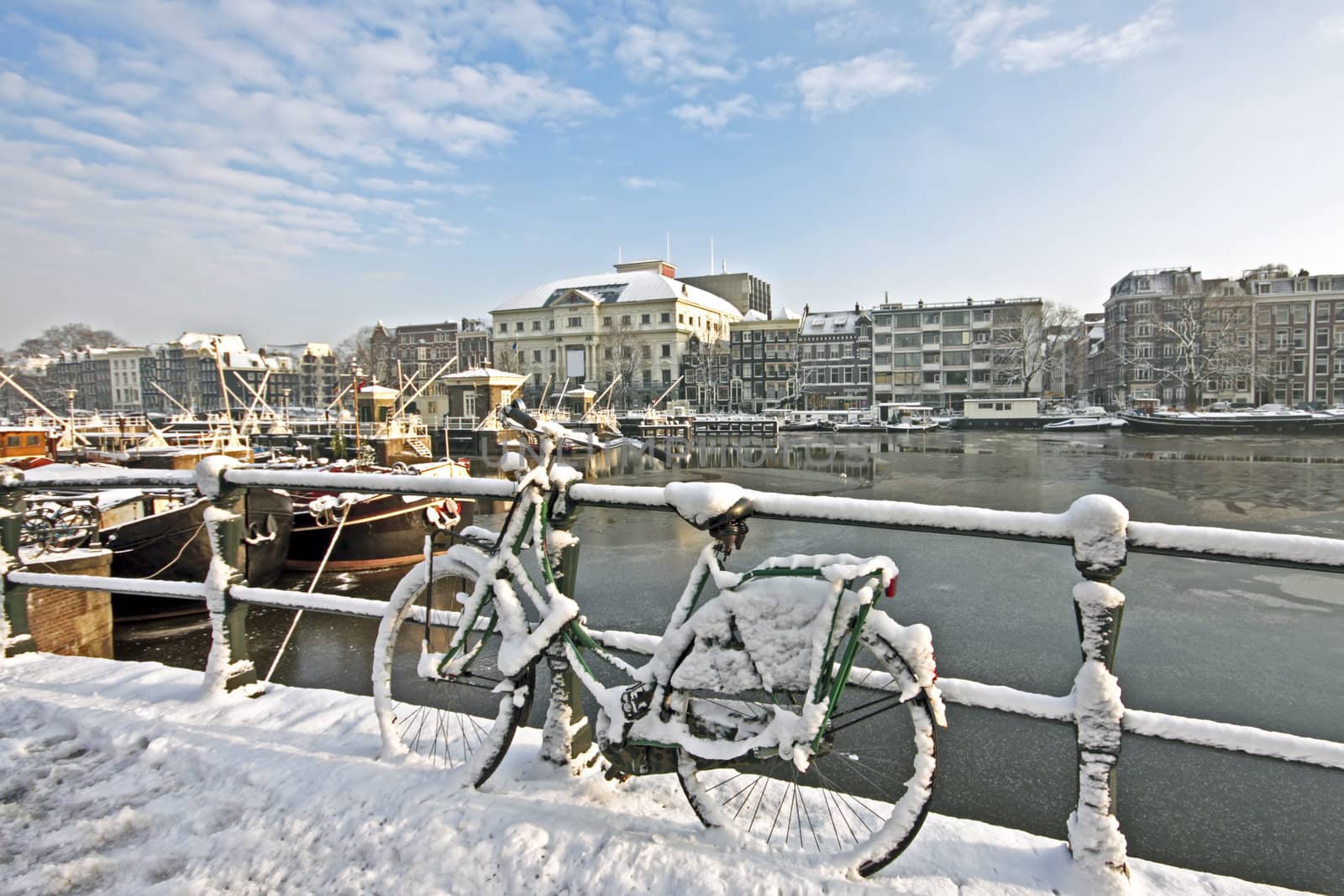 Snowy Amsterdam at the Amstel in the Netherlands