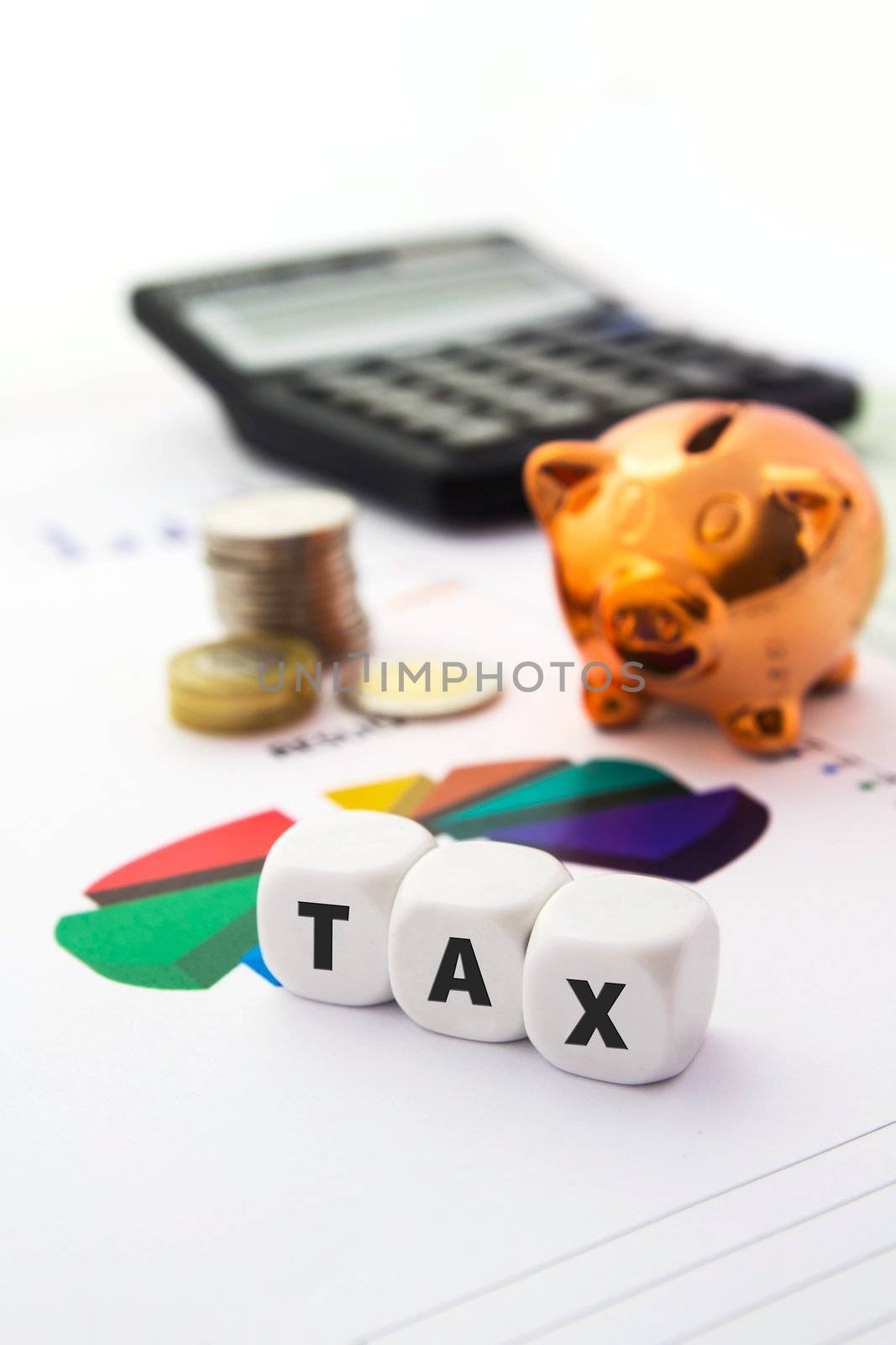 Tax composition on white dices. Piggybank in background