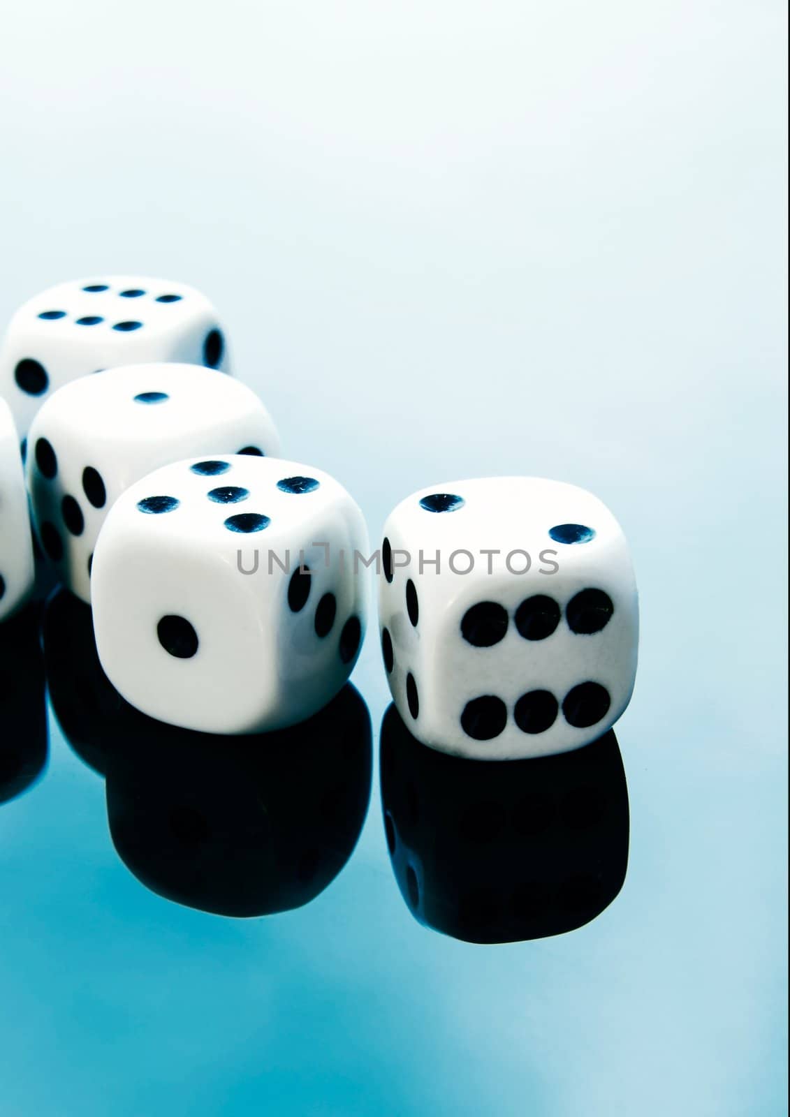 Dices on blue reflected background
