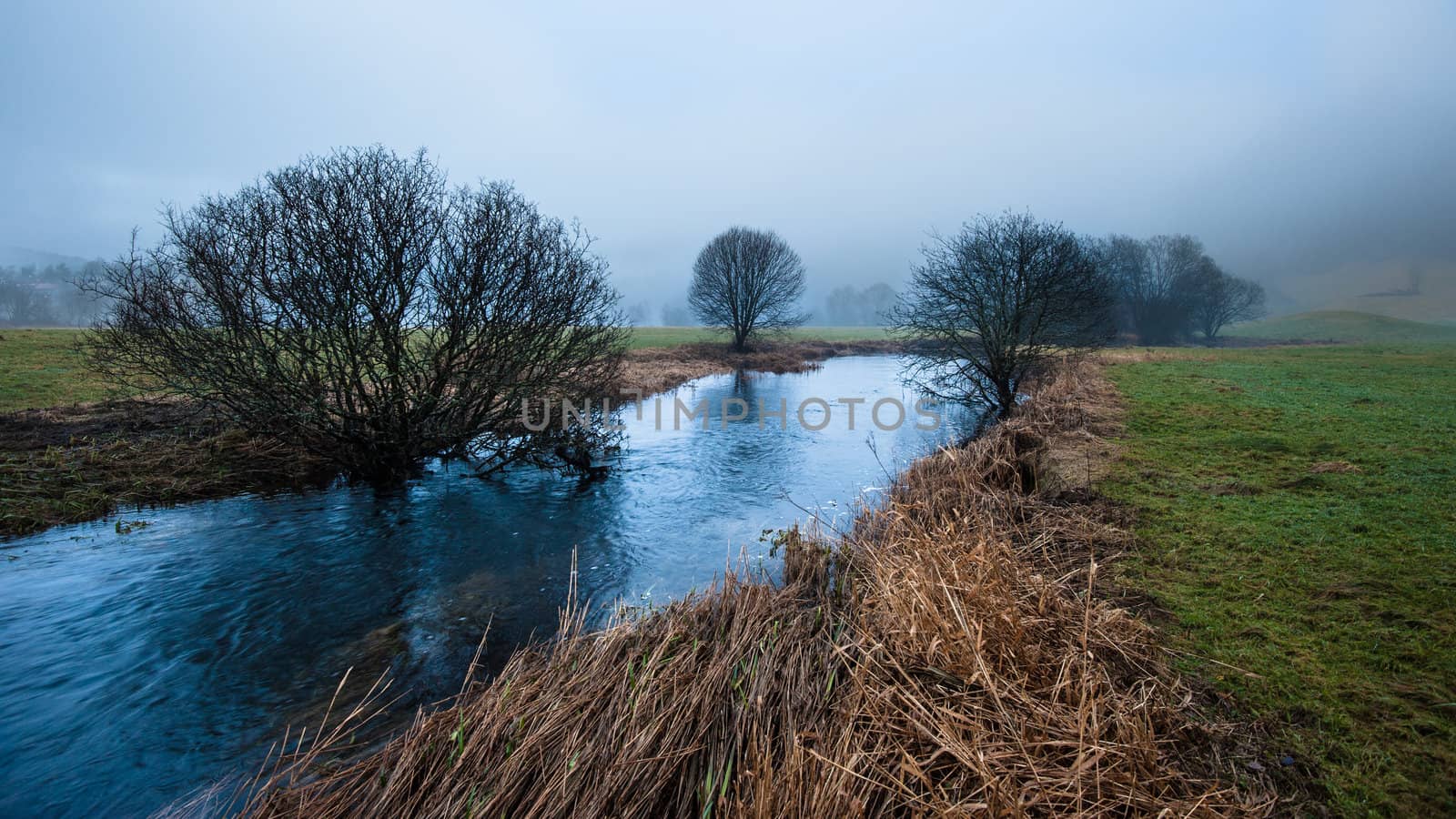 A river in norway in foggy weather