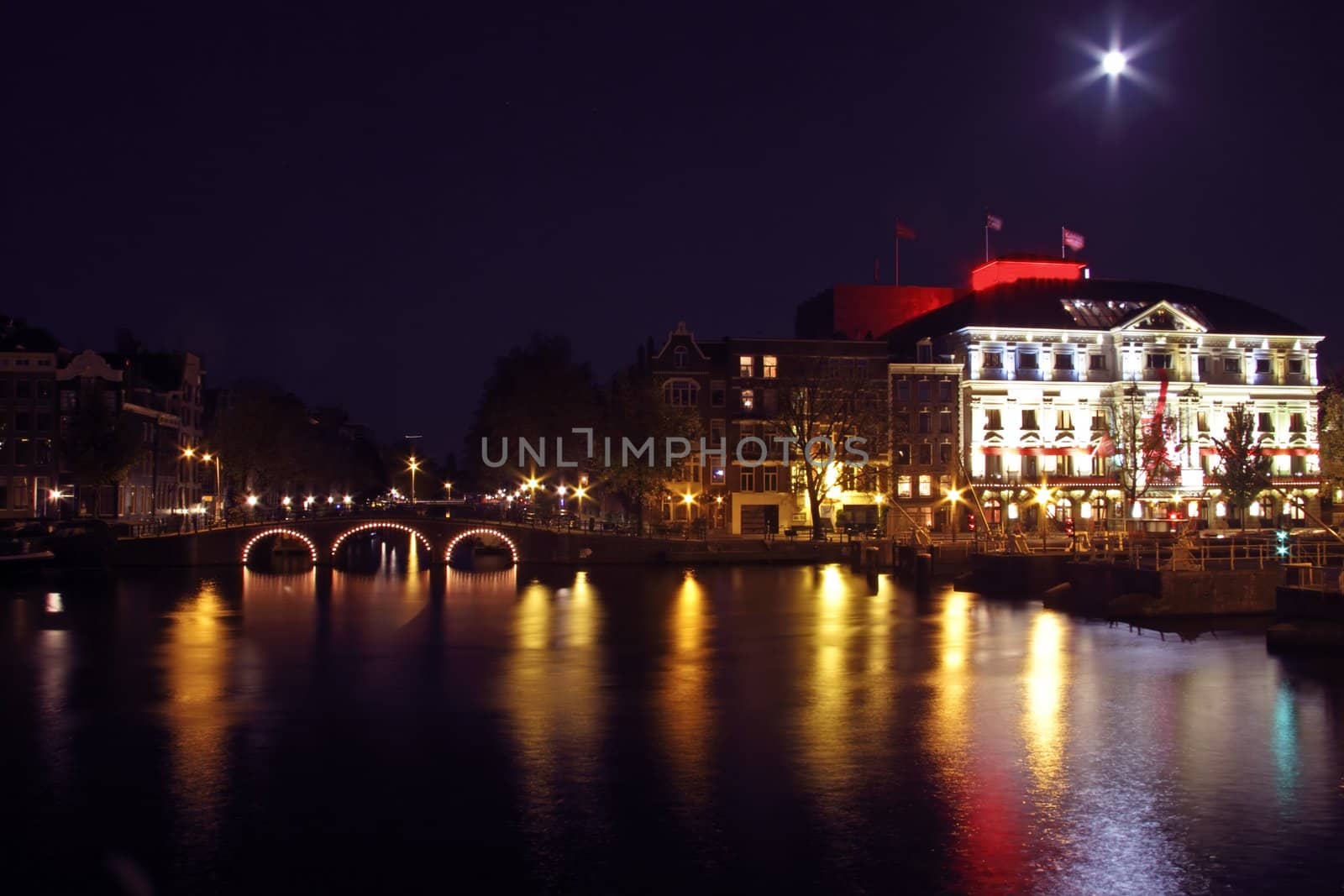 City scenic from Amsterdam by night in the Netherlands