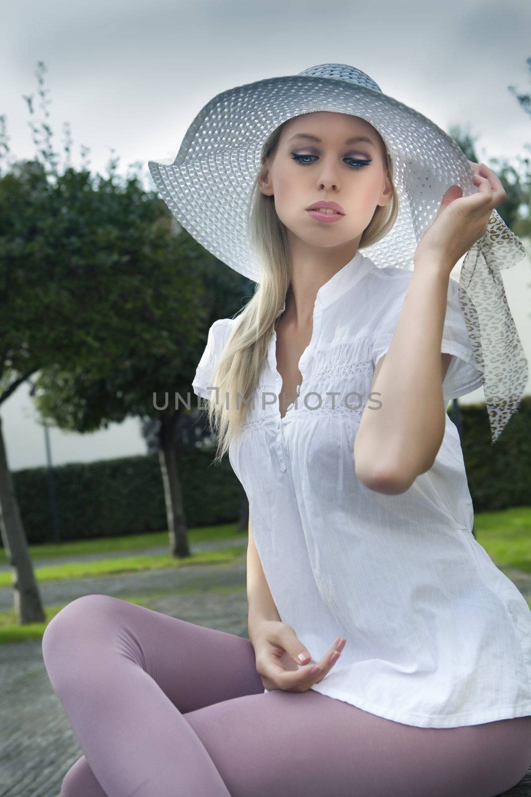 sexy young blond girl in summer hat