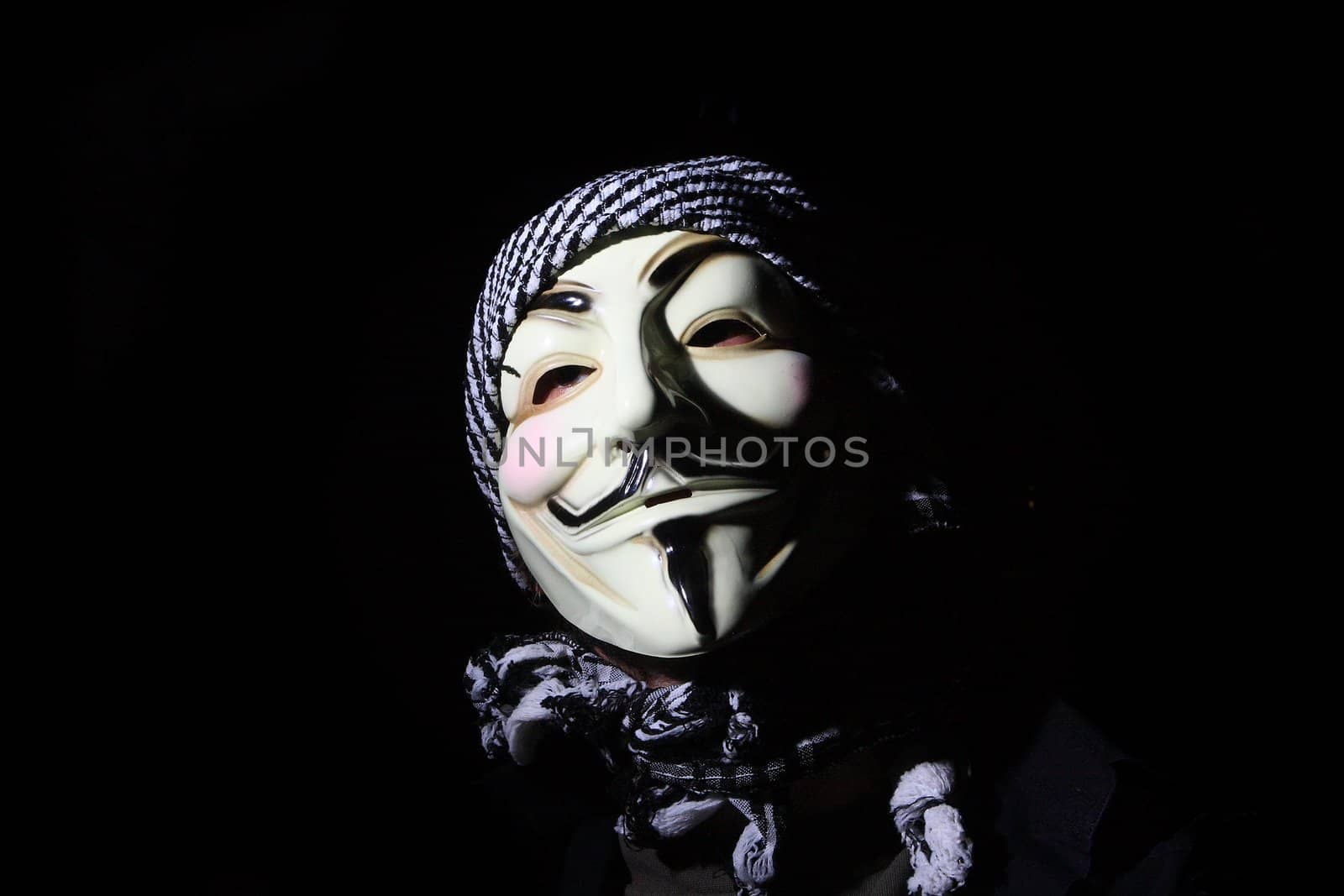 man in a white mask on a black background