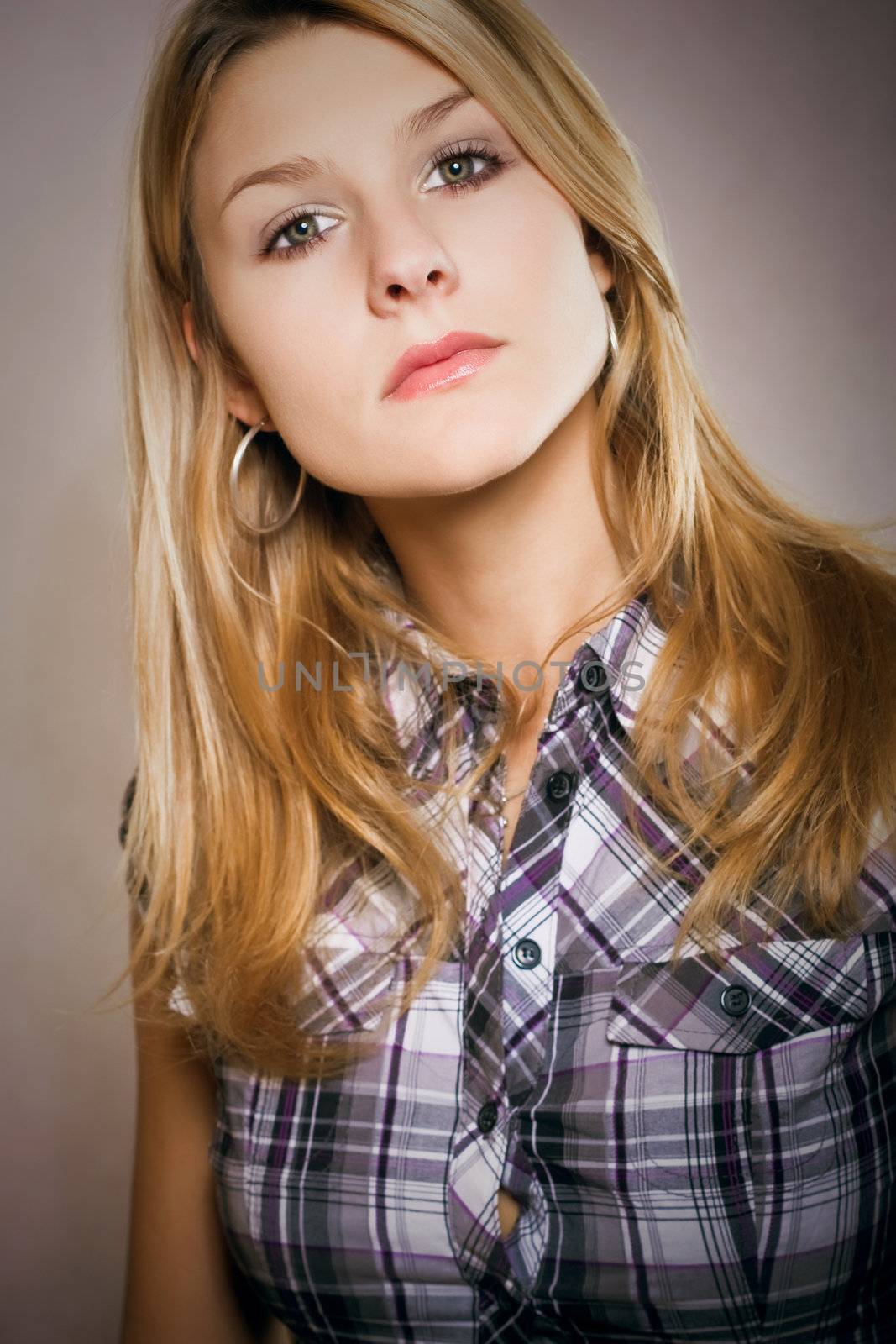 beautiful attractive young blond girl in colorful shirt