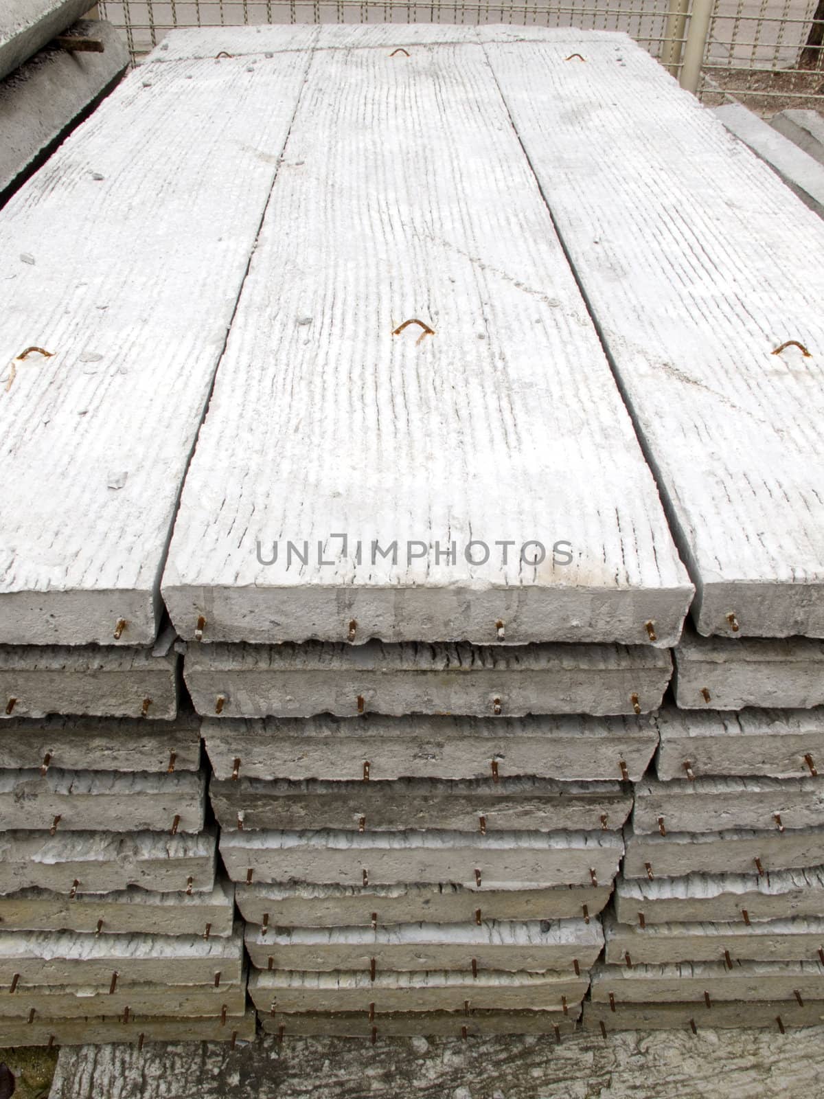 Stack of concrete building slab on ground in stock