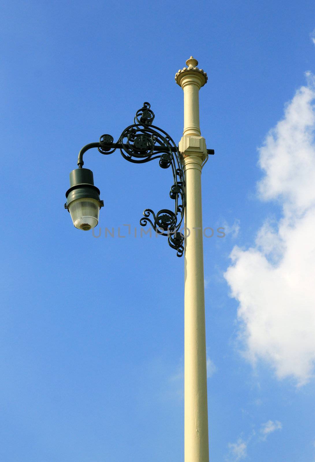 Retro street lamp-post on blue sky by nuchylee