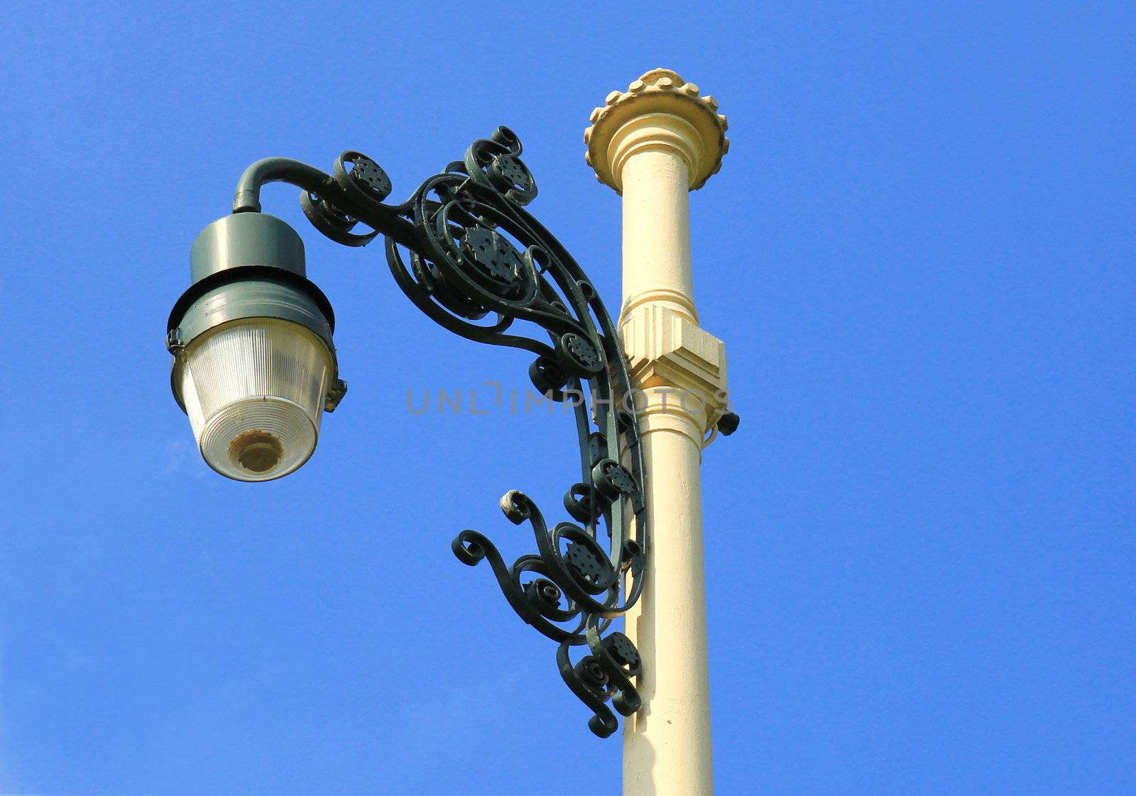 Retro street lamp-post on blue sky by nuchylee