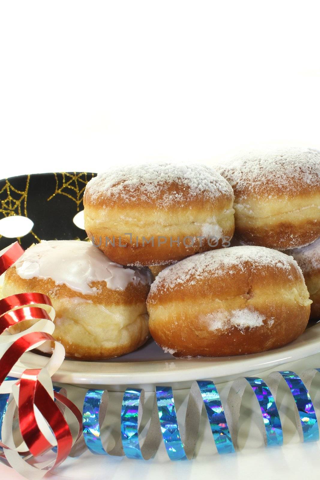 a plate of donuts and carnival decoration