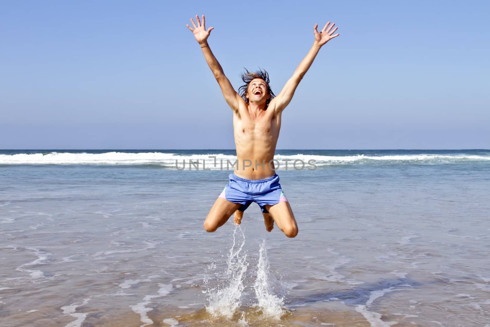 Happy guy jumping out of the water by devy