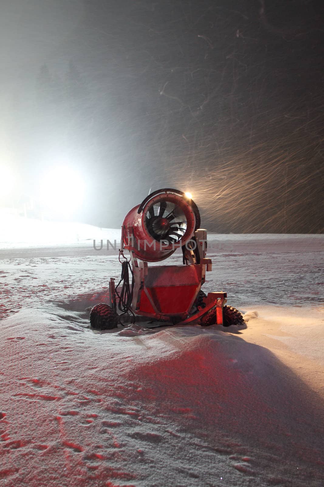 Night shot of artificial snow making machine 