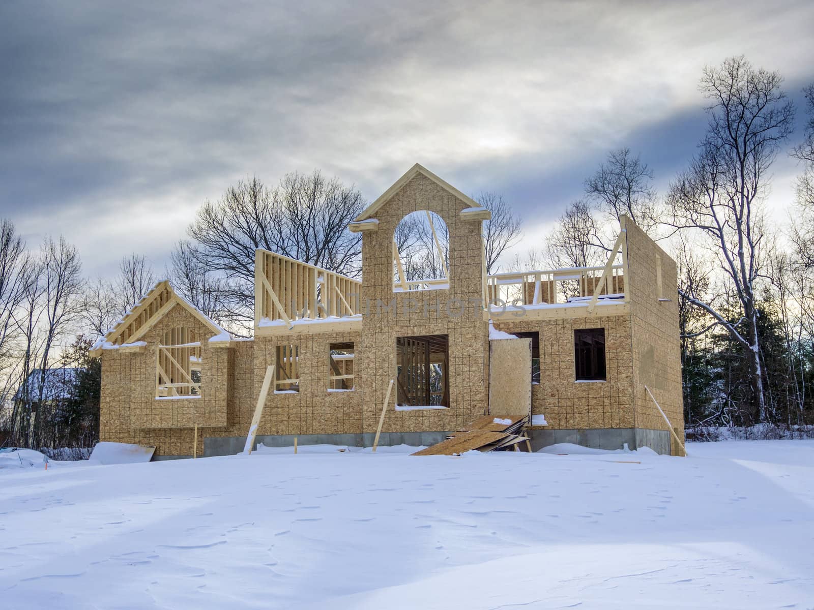 New house framing construction taking place in winter