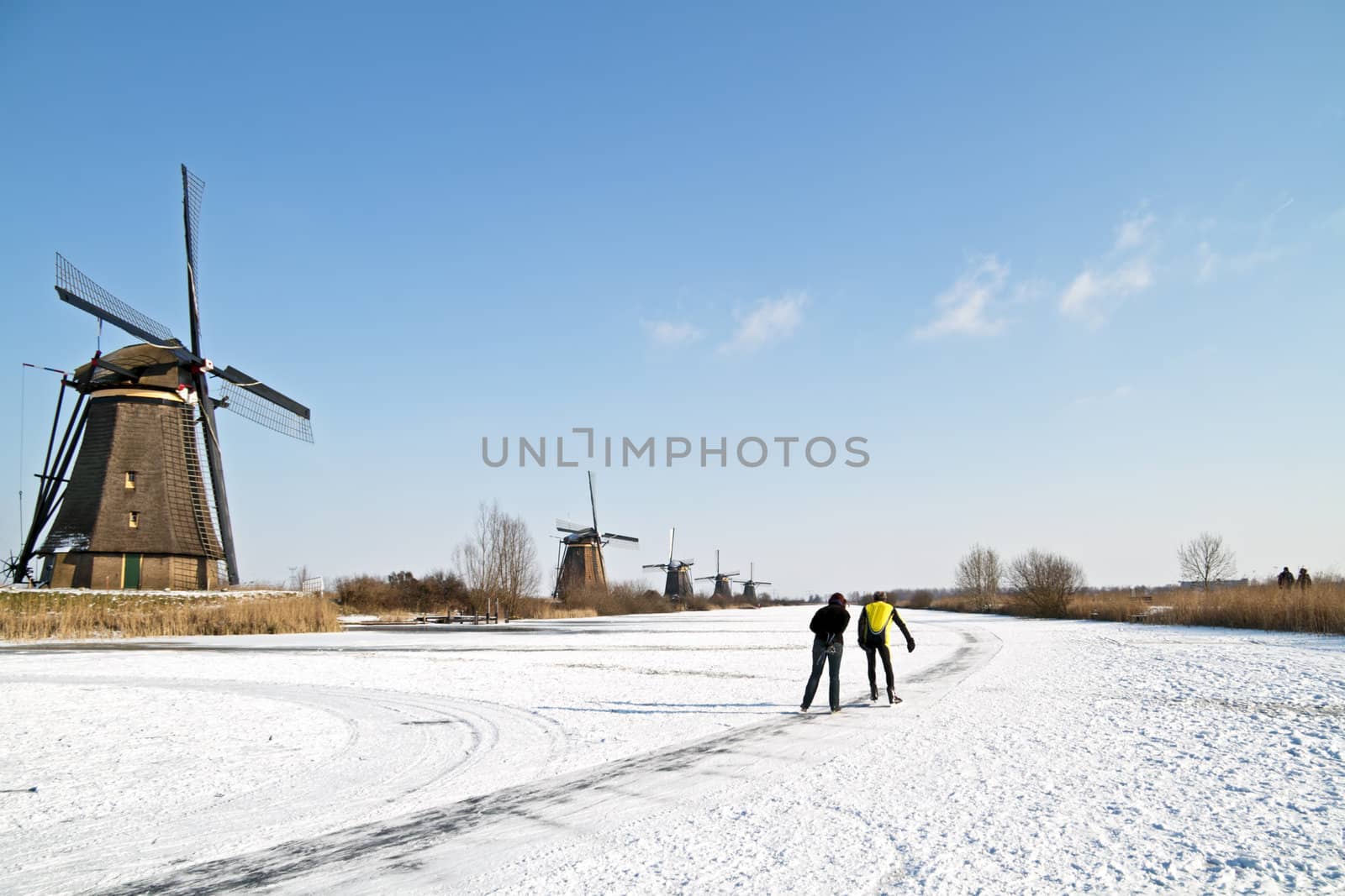 Ice skating at Kinderdijk in the winter in the Netherlands