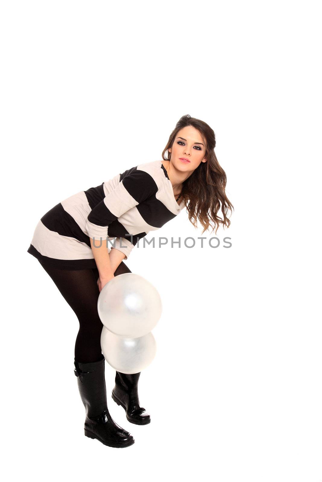 young girl holding balloons isolated on a white background