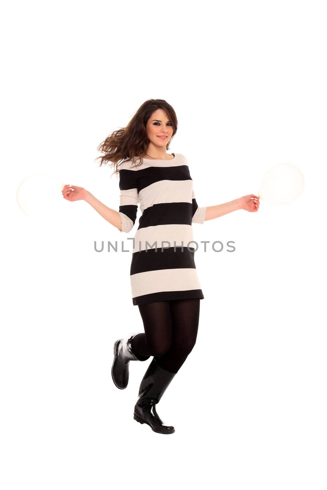 young girl holding balloons isolated on a white background